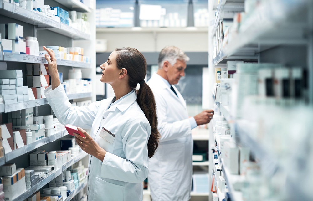 pharmacists filling prescriptions inside the pharmacy