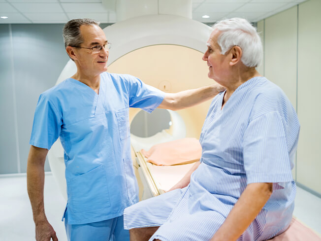 male physician preparing a male patient for an MRI for web