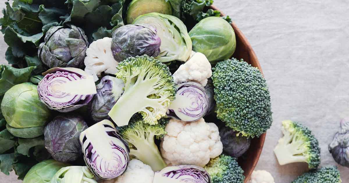 Cruciferous vegetables, cauliflower,broccoli, Brussels sprouts, kale in wooden bowl