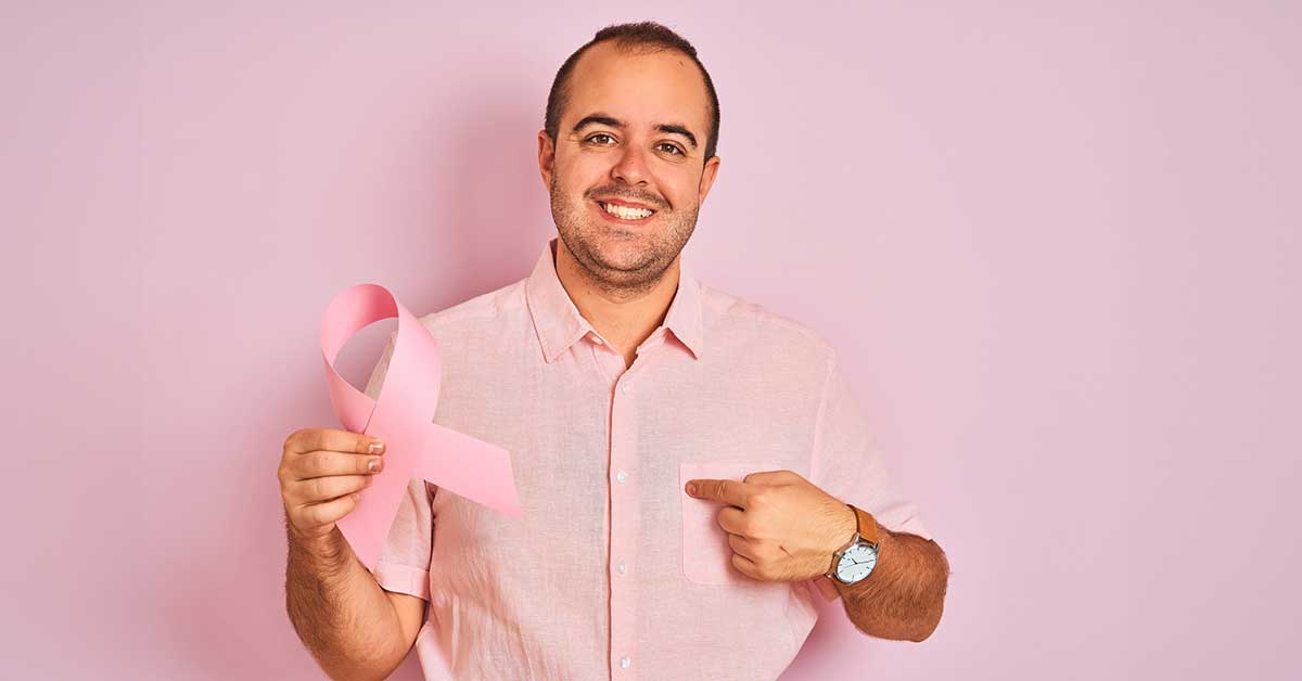 man holding cancer ribbon