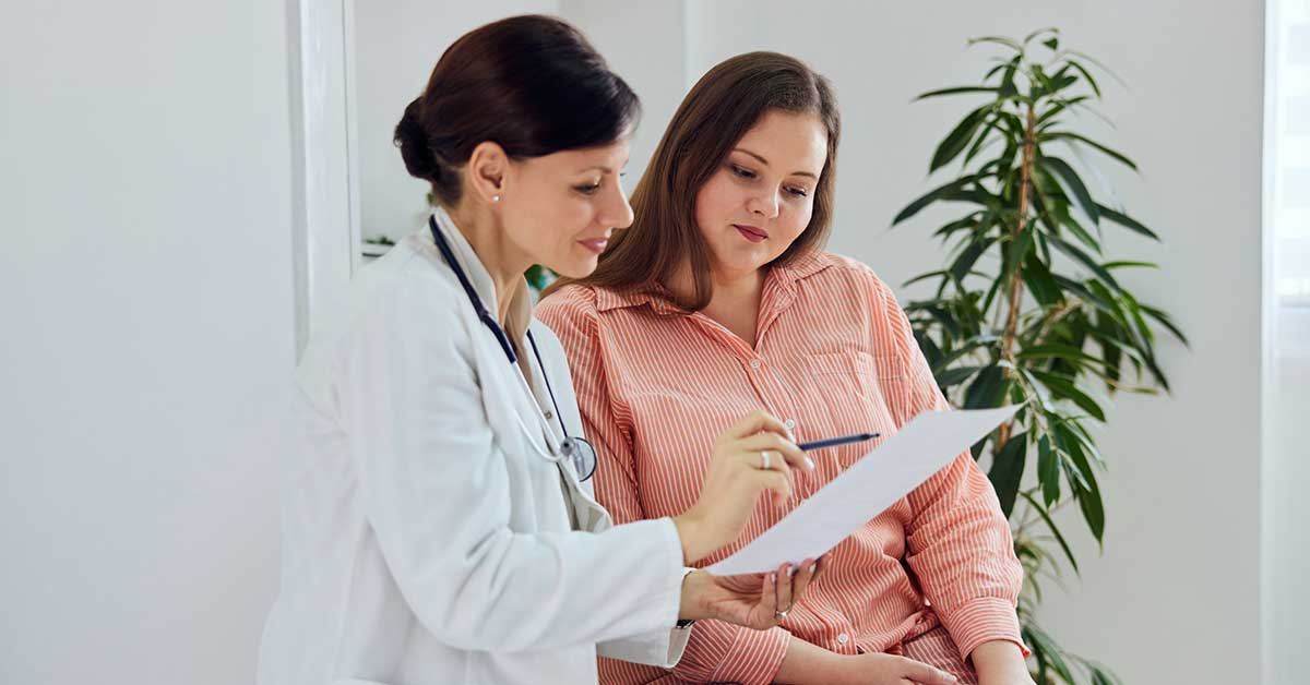 woman talking to doctor