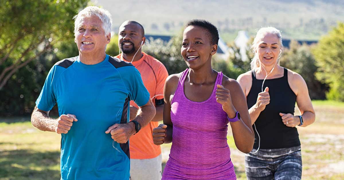 adults jogging at park