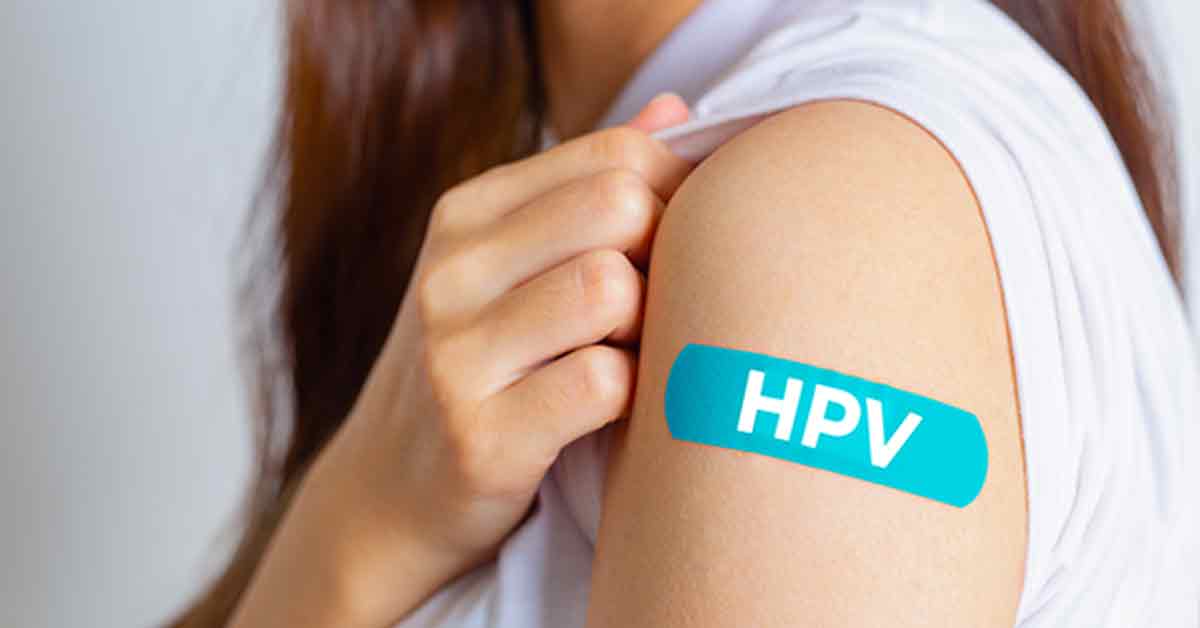 Girl with HPV Vaccine Band-Aid on arm