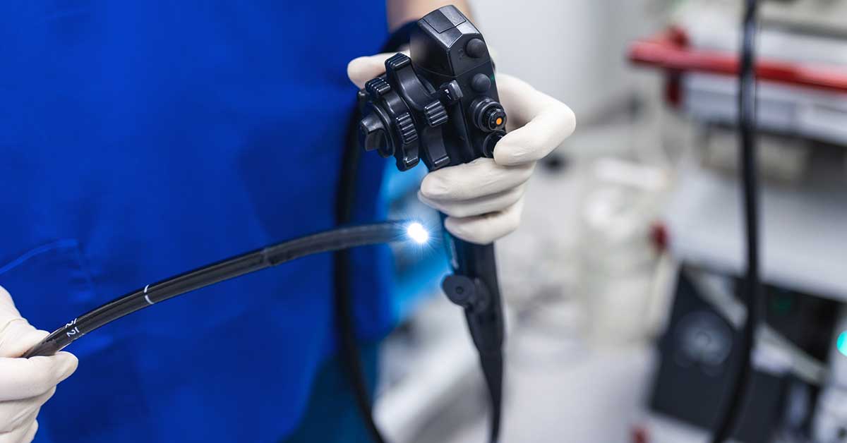 Endoscopy at the hospital. Doctor holding endoscope before gastroscopy.