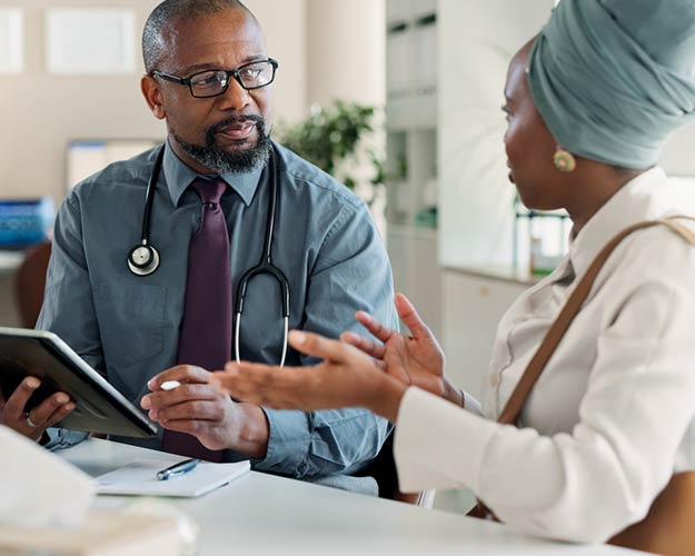 black doctor with patient