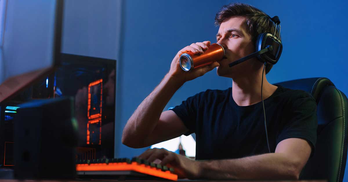 man drinking energy drink