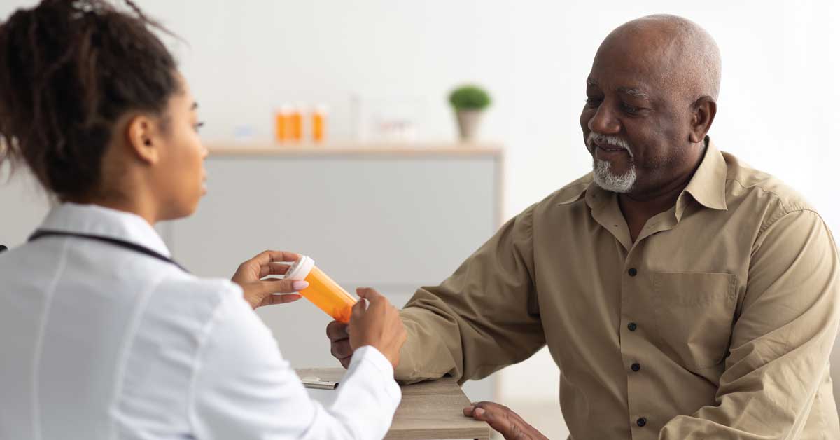 Man talking to doctor about medication